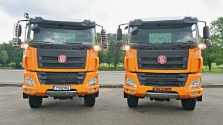 Dva oranžové nákladní vozy Tatra Phoenix z čelního pohledu.