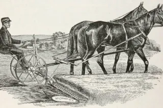 Historická kresba sklízecího stroje taženého koněm