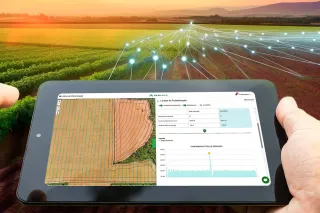 Tablet s mapou pole a grafickým zobrazením digitálního zemědělství