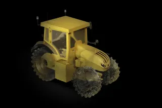 Žlutý traktor osvětlený proti tmavému pozadí