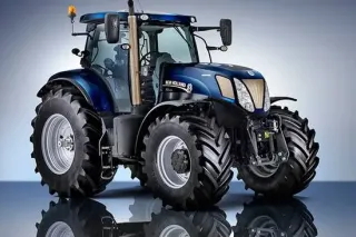 Tmavě modrý traktor New Holland na studiovém snímku.
