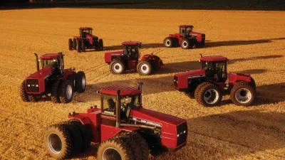 Pět červených kloubových traktorů Steiger na poli