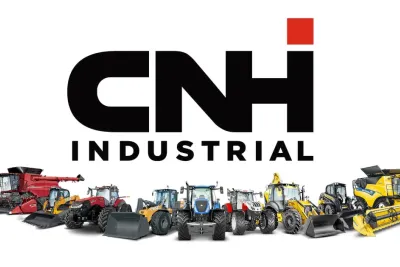 Logo CNH Industrial nad řadou zemědělských a stavebních strojů.